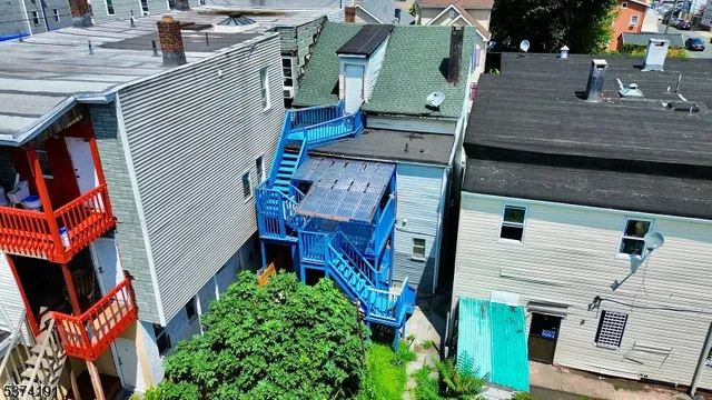 an aerial view of houses with an outdoor space