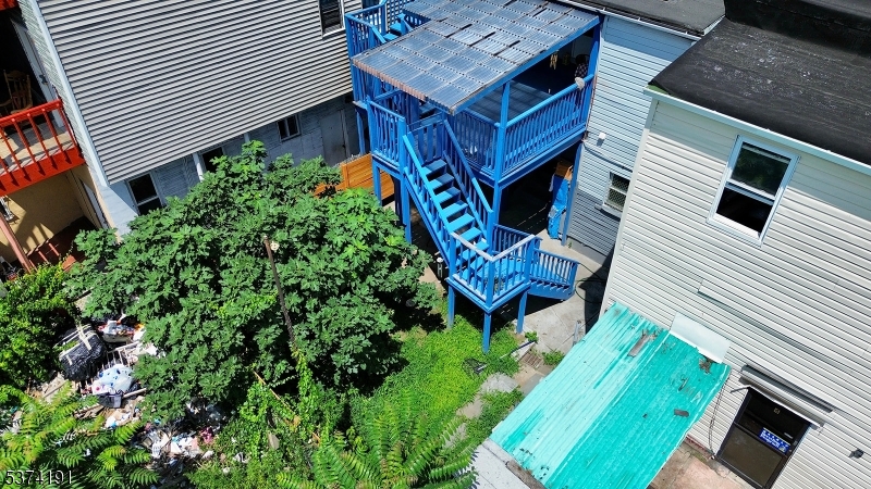 50 Oak Street Paterson, NJ 07501 - Photo 6 of 28 a view of a chairs in a patio