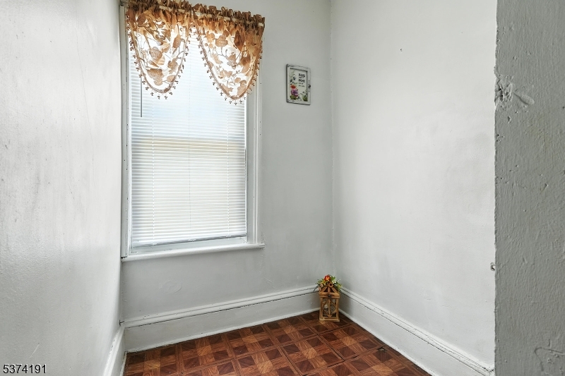50 Oak Street Paterson, NJ 07501 - Photo 9 of 28 a bathroom with a window