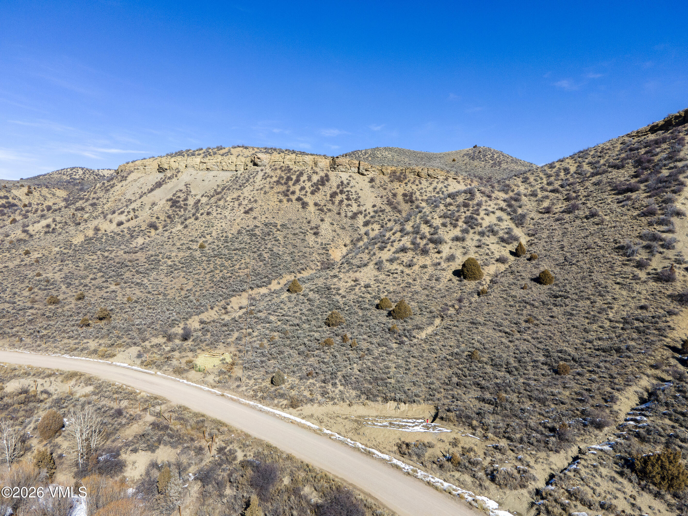 1697 Elk Ridge Road Wolcott, CO 81655 - Photo 22 of 37 a view of a large building with mountains in the background