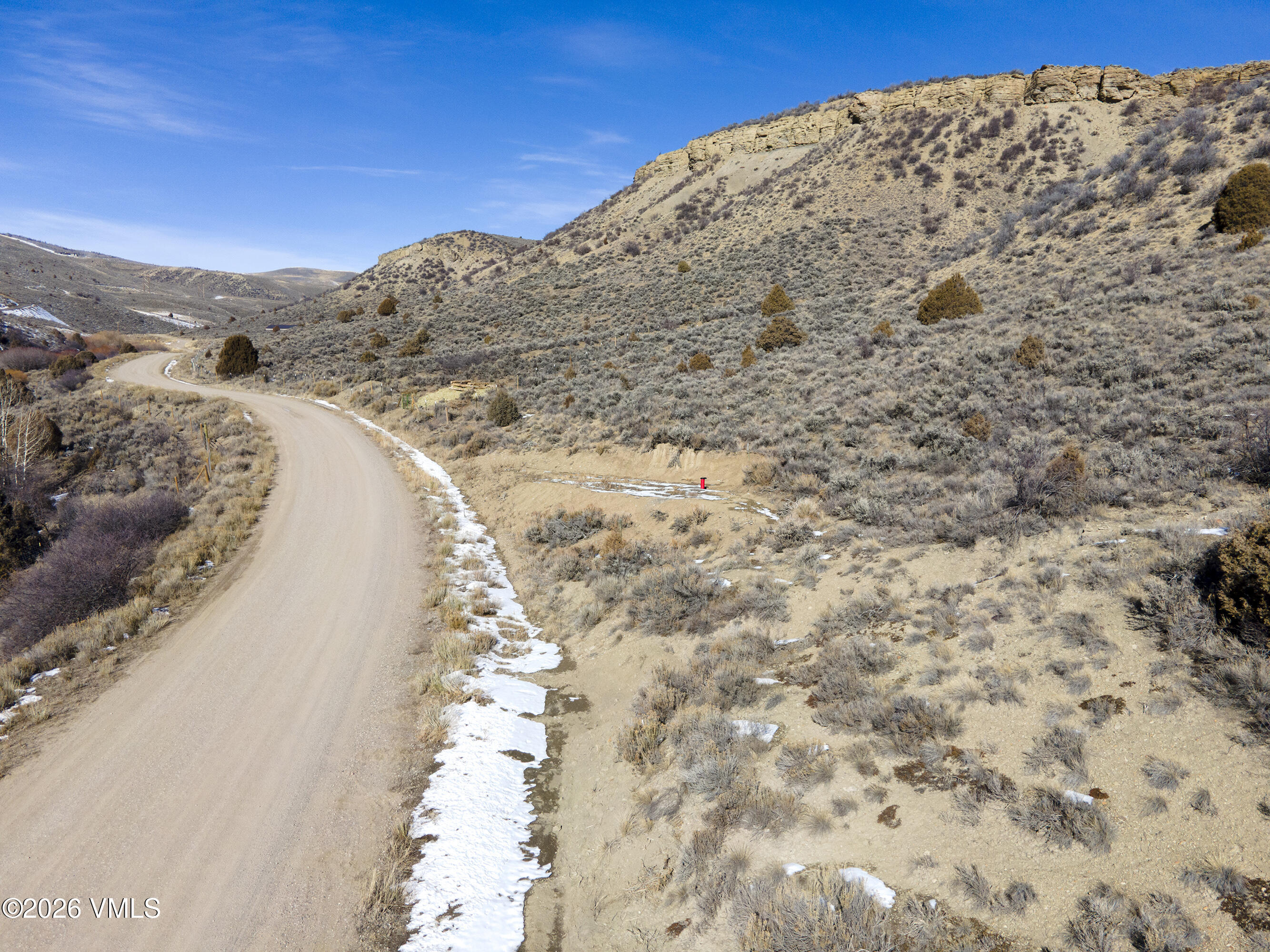 1697 Elk Ridge Road Wolcott, CO 81655 - Photo 24 of 37 a view of a dry yard with mountains in the background