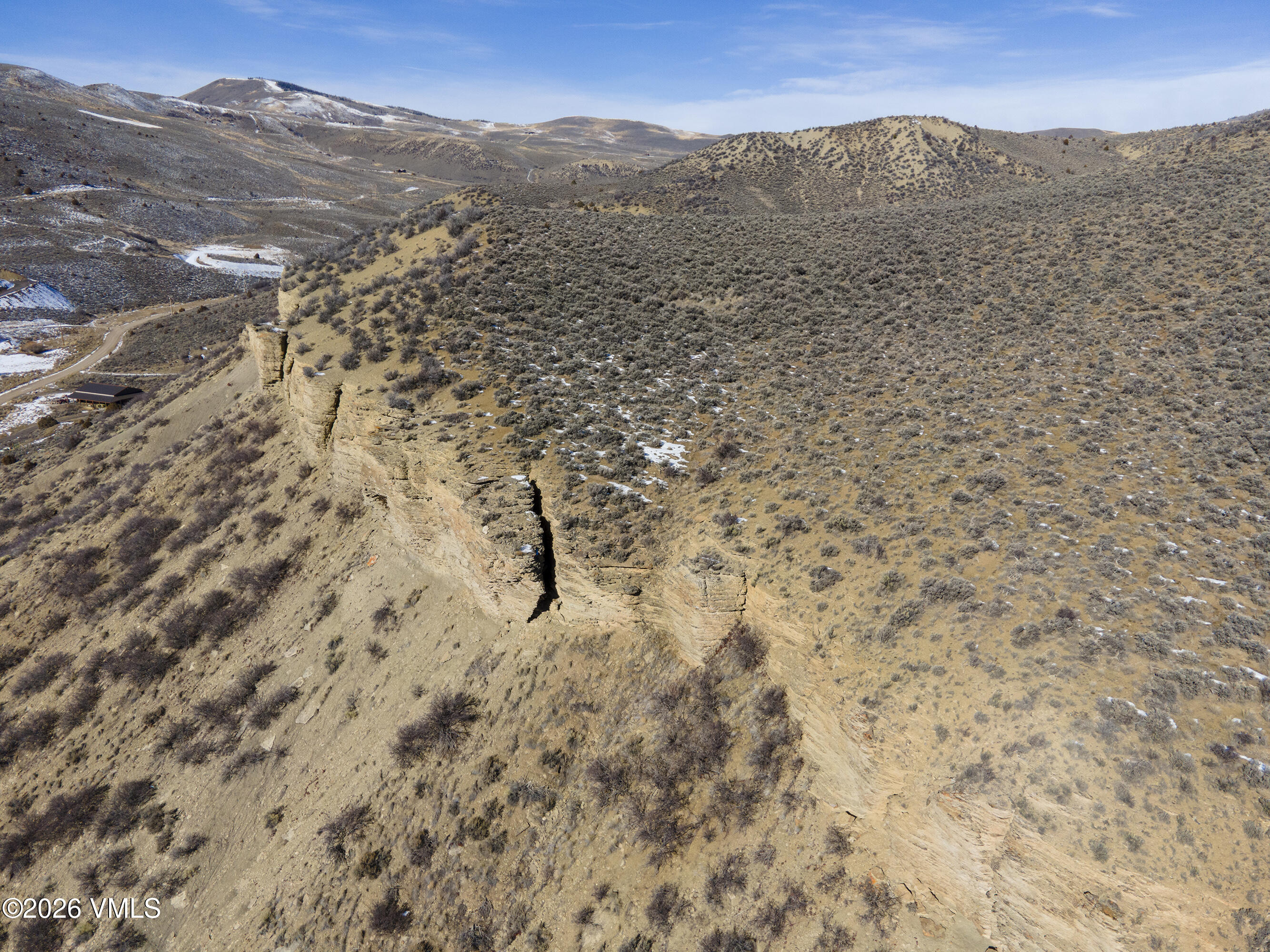 1697 Elk Ridge Road Wolcott, CO 81655 - Photo 28 of 37 a view of a dry yard with mountains in the background