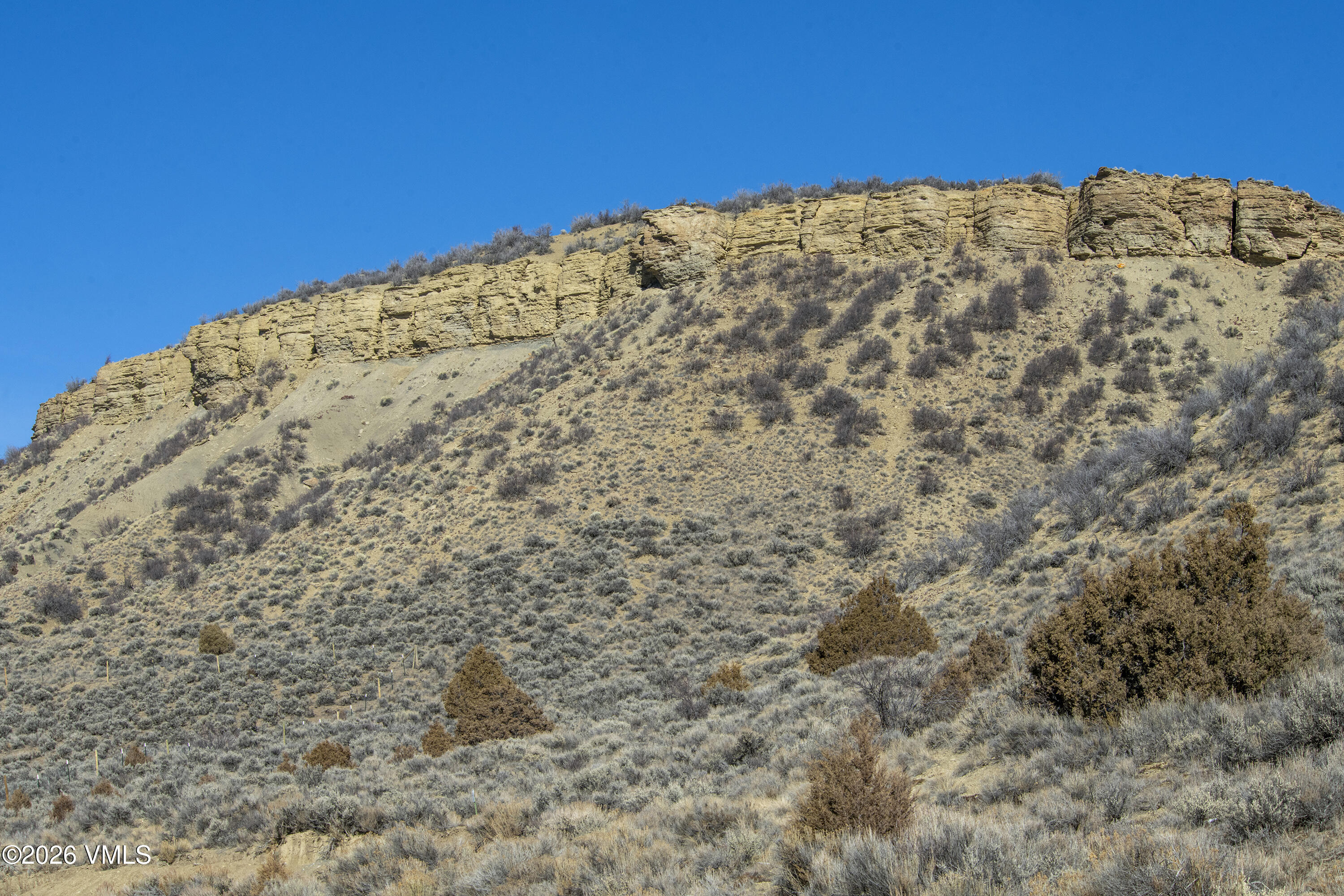 1697 Elk Ridge Road Wolcott, CO 81655 - Photo 33 of 37 a view of a large building with mountains in the background