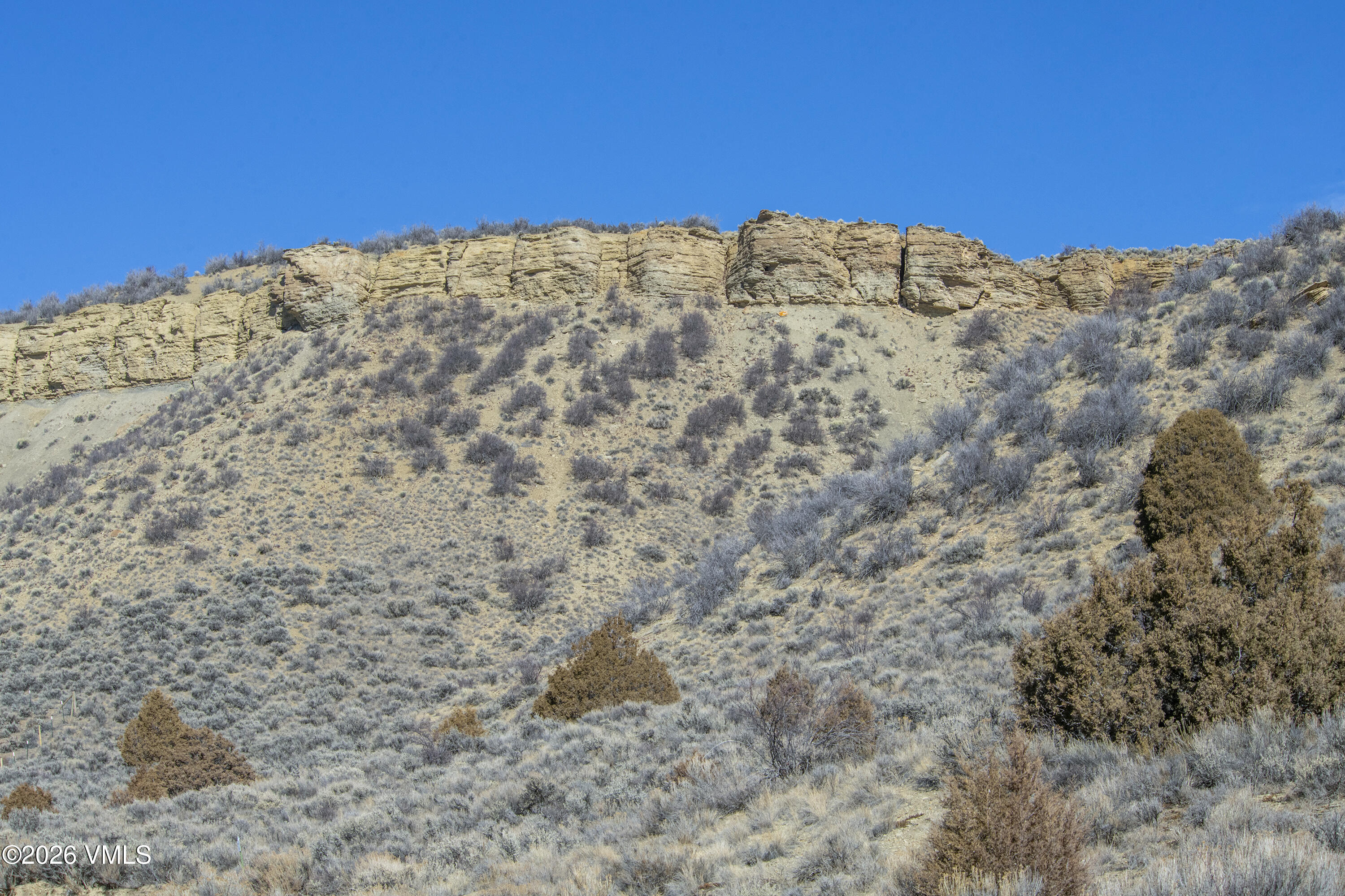 1697 Elk Ridge Road Wolcott, CO 81655 - Photo 34 of 37 a view of a large building with mountains in the background