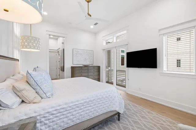 a bedroom with a bed and a television