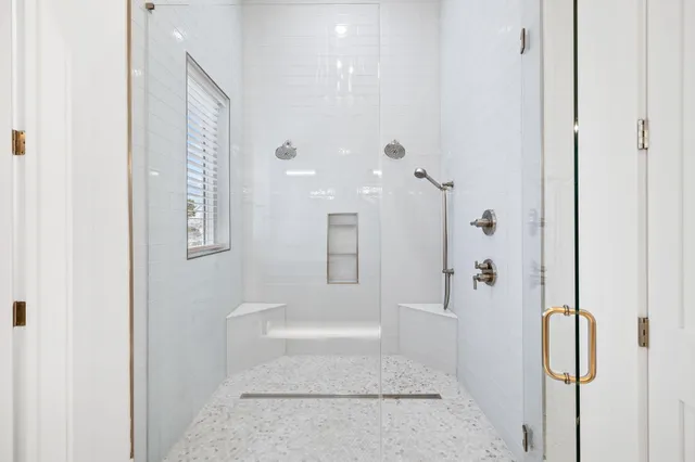 a front view of a residential houses with yard and green space