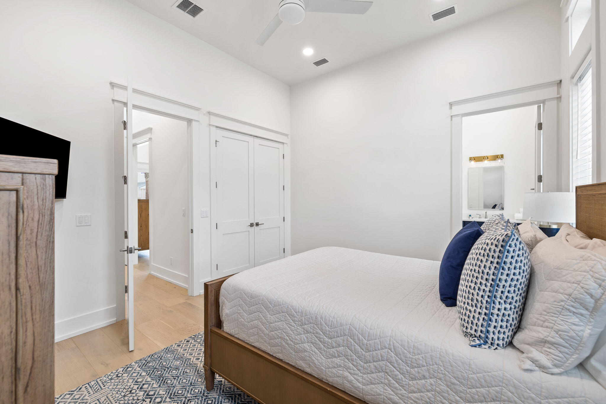 311 Walton Rose Ln Inlet Beach Inlet Beach, FL 32461 - Photo 82 of 90 a bedroom with a large bed and a chandelier