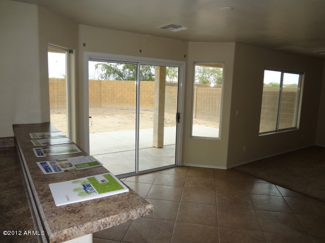 9204 West Payson Road Tolleson, AZ 85353 - Photo 5 of 17 a view of kitchen with furniture and large window