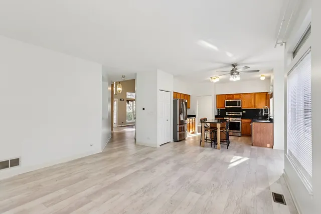 a view of game room with window and refrigerator