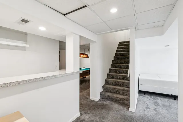 a view of a kitchen with workspace and a window