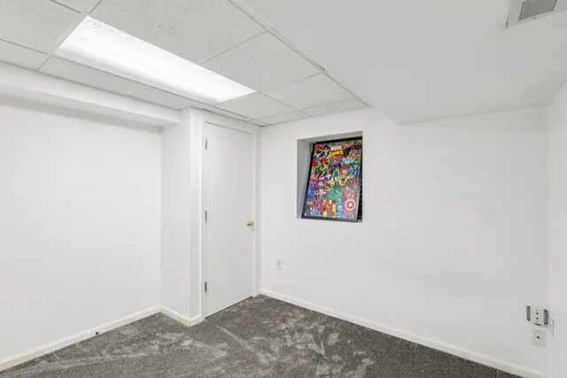 a room with a bed and a window