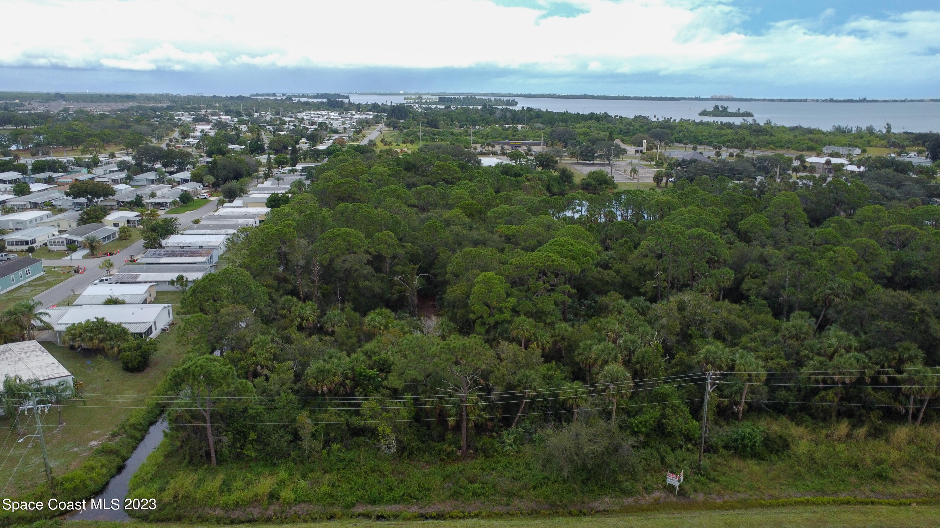 0 Micco Road Micco, FL 32976 - Photo 2 of 6 an aerial view of residential houses with outdoor space and trees