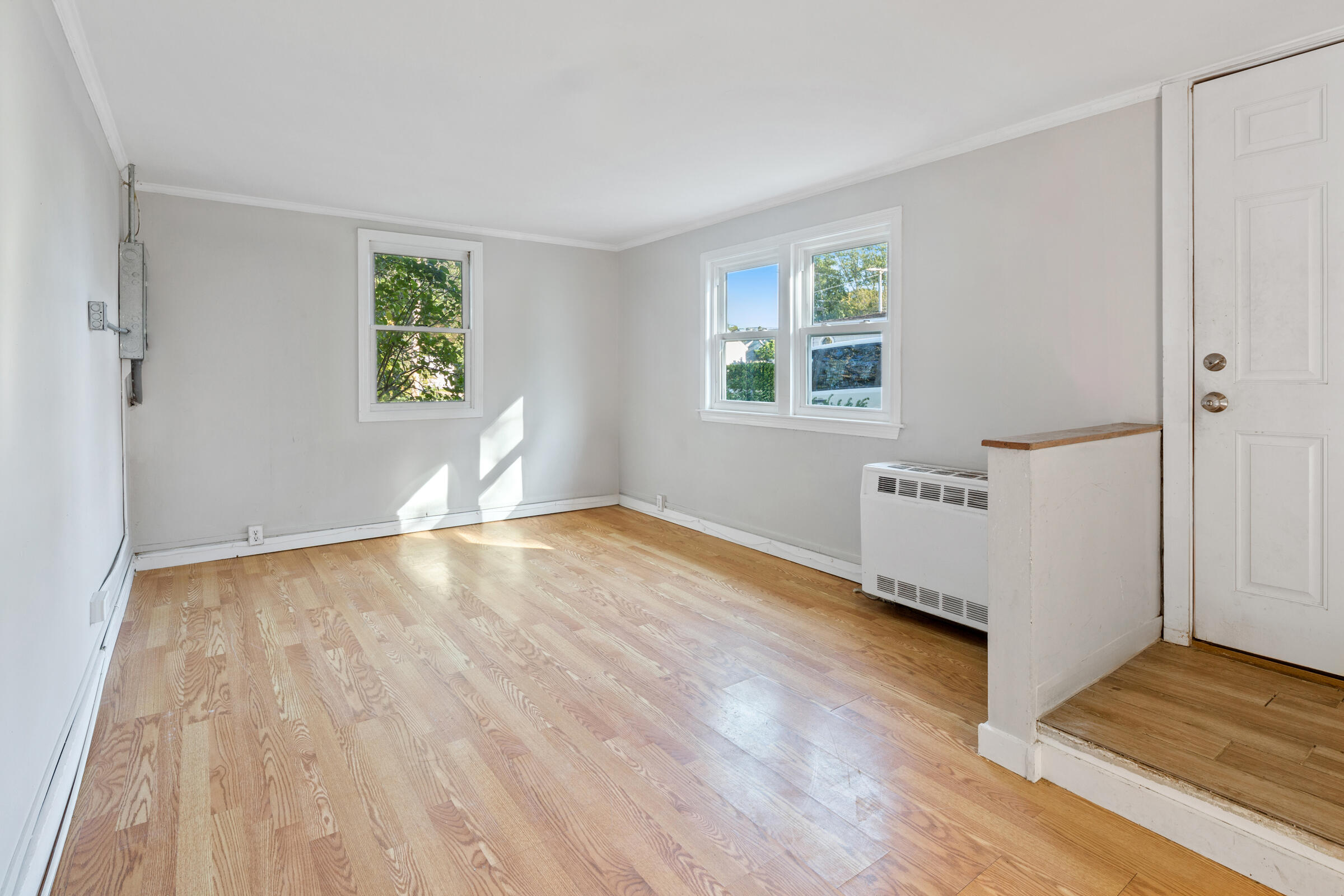 15 Bee Lane Centerville, MA 02632 - Photo 2 of 11 a view of empty room with wooden floor and fan