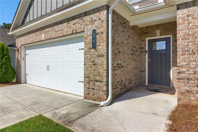 a front view of a house with an empty space