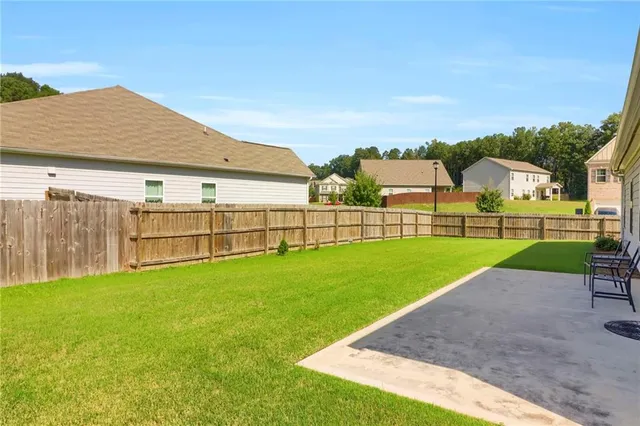 a view of an house with a big yard
