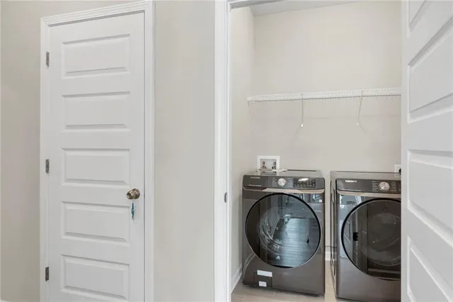 a utility room with dryer and washer