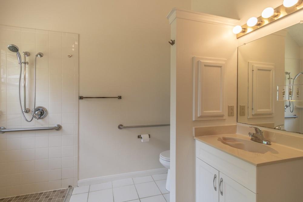 2411 Raintree Path Round Rock, TX 78664 - Photo 14 of 28 a bathroom with a shower sink and mirror