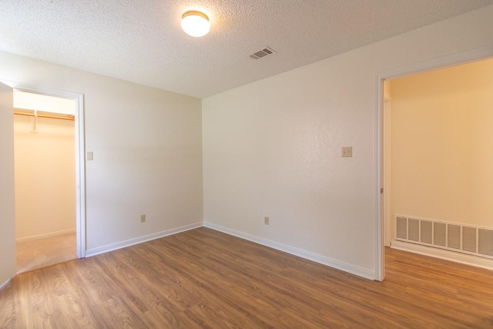 2411 Raintree Path Round Rock, TX 78664 - Photo 23 of 28 a view of a room with wooden floor and a window