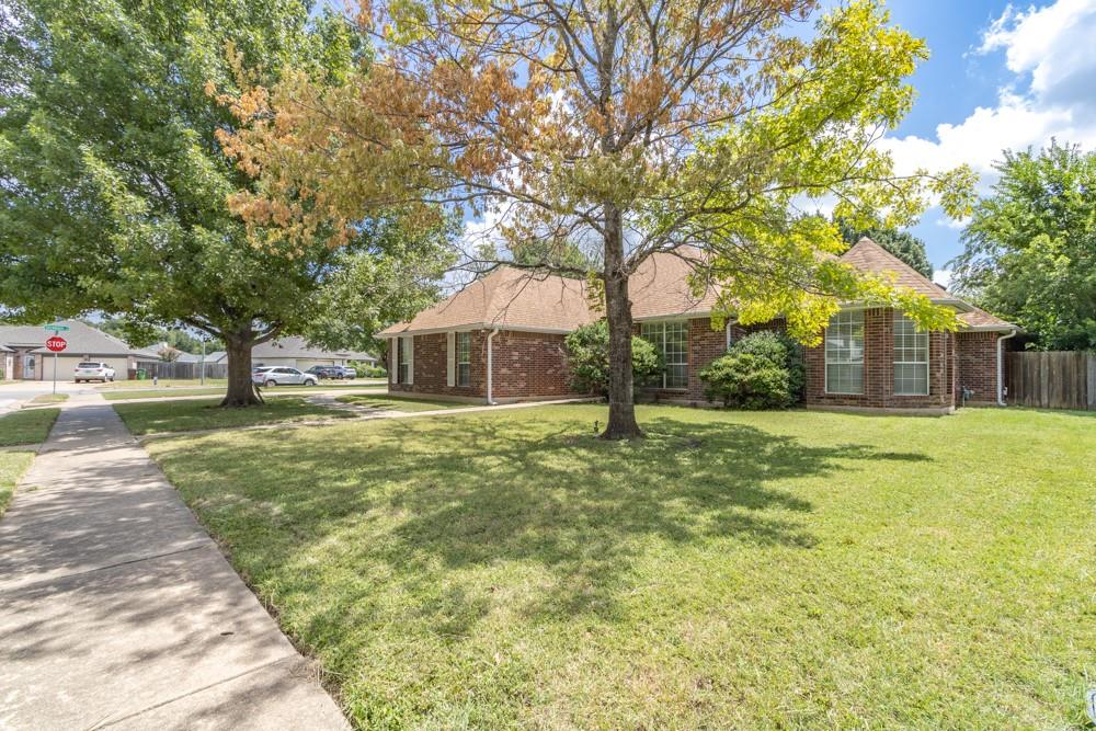 2411 Raintree Path Round Rock, TX 78664 - Photo 24 of 28 a front view of a house with garden