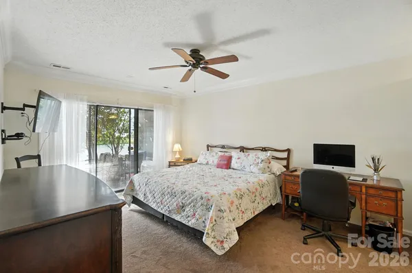 a bedroom with a bed and furniture