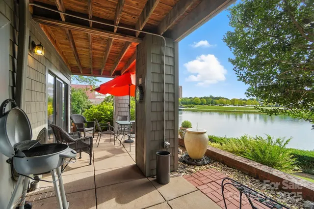a view of swimming pool with a patio and a yard