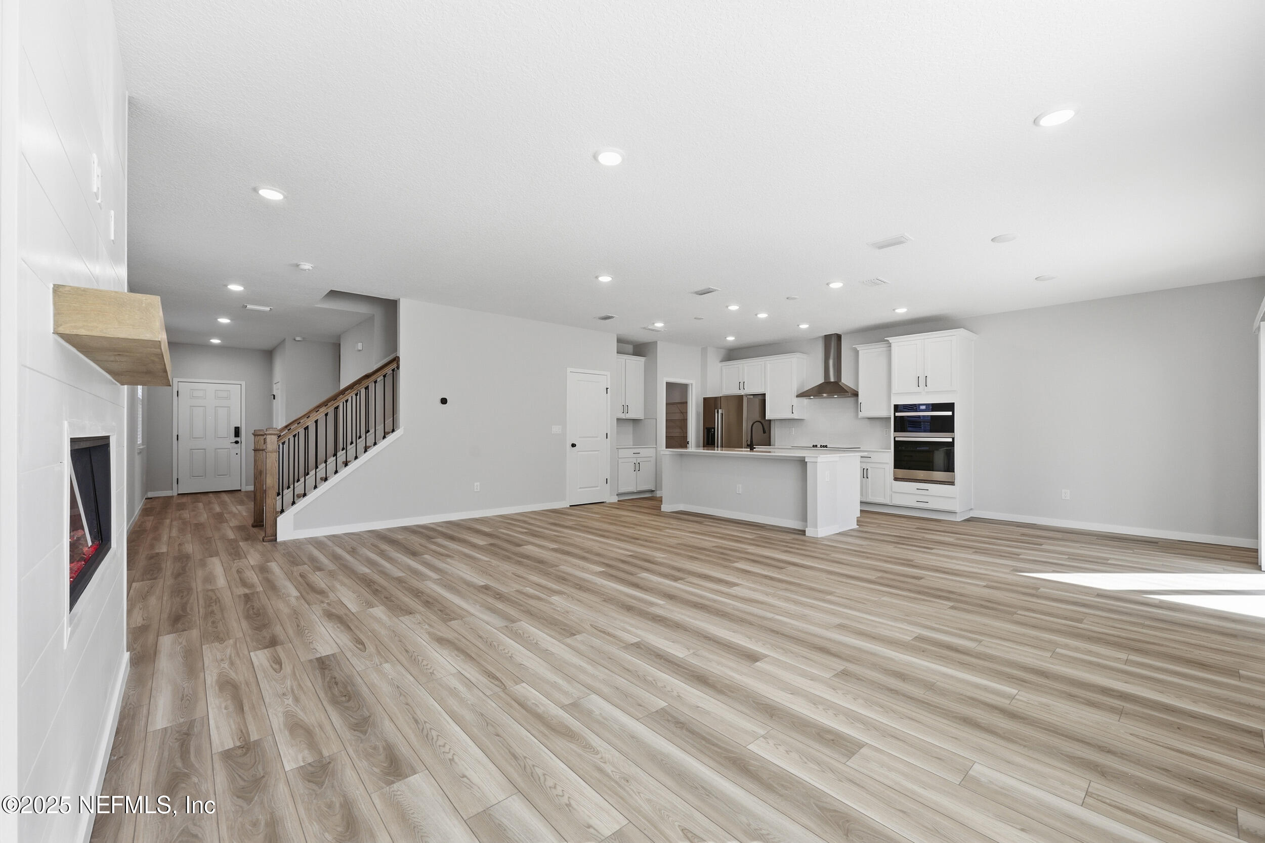96509 Stillpoint Way Fernandina Beach, FL 32034 - Photo 12 of 32 a view of empty room with wooden floor