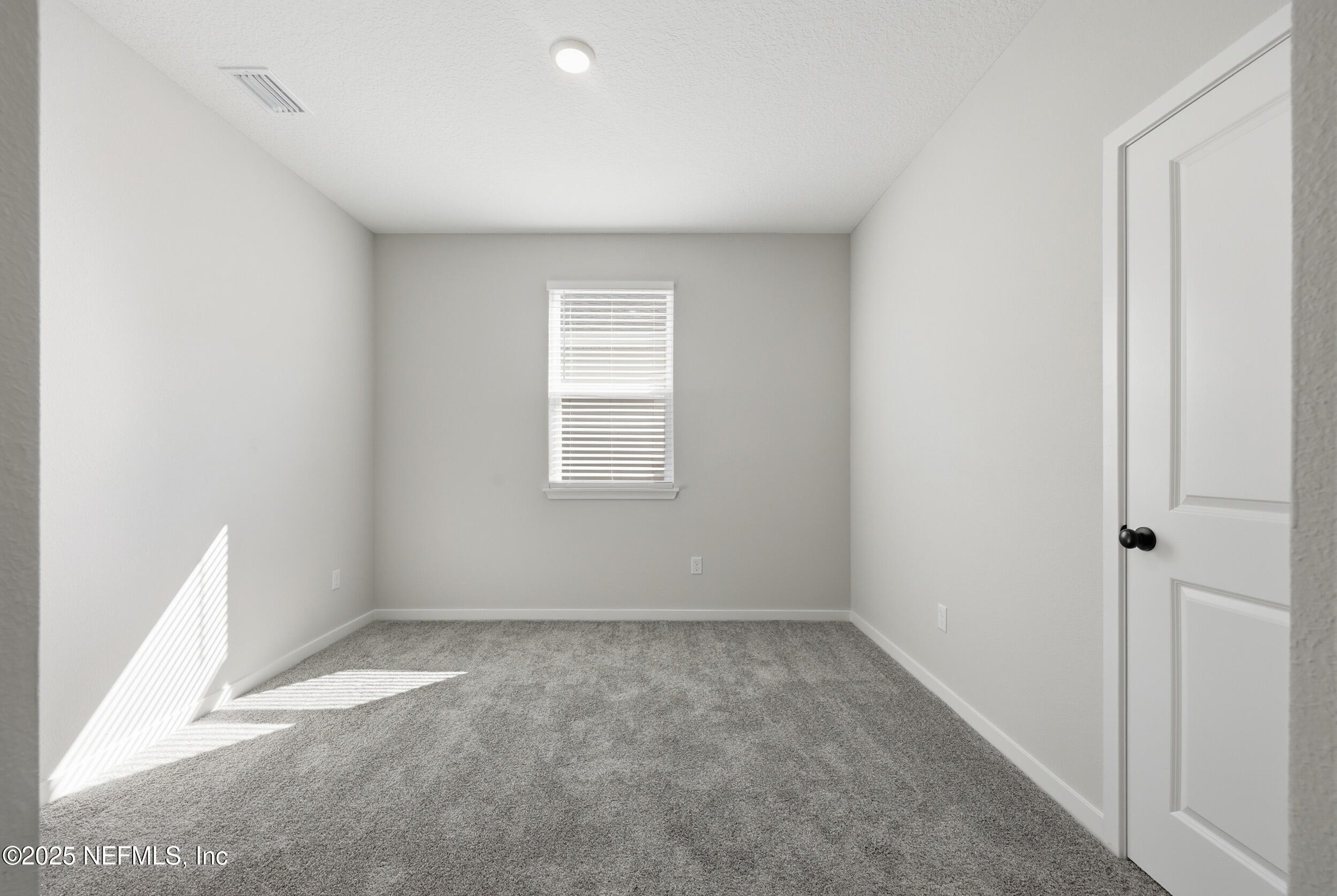 96509 Stillpoint Way Fernandina Beach, FL 32034 - Photo 15 of 32 an empty room with windows