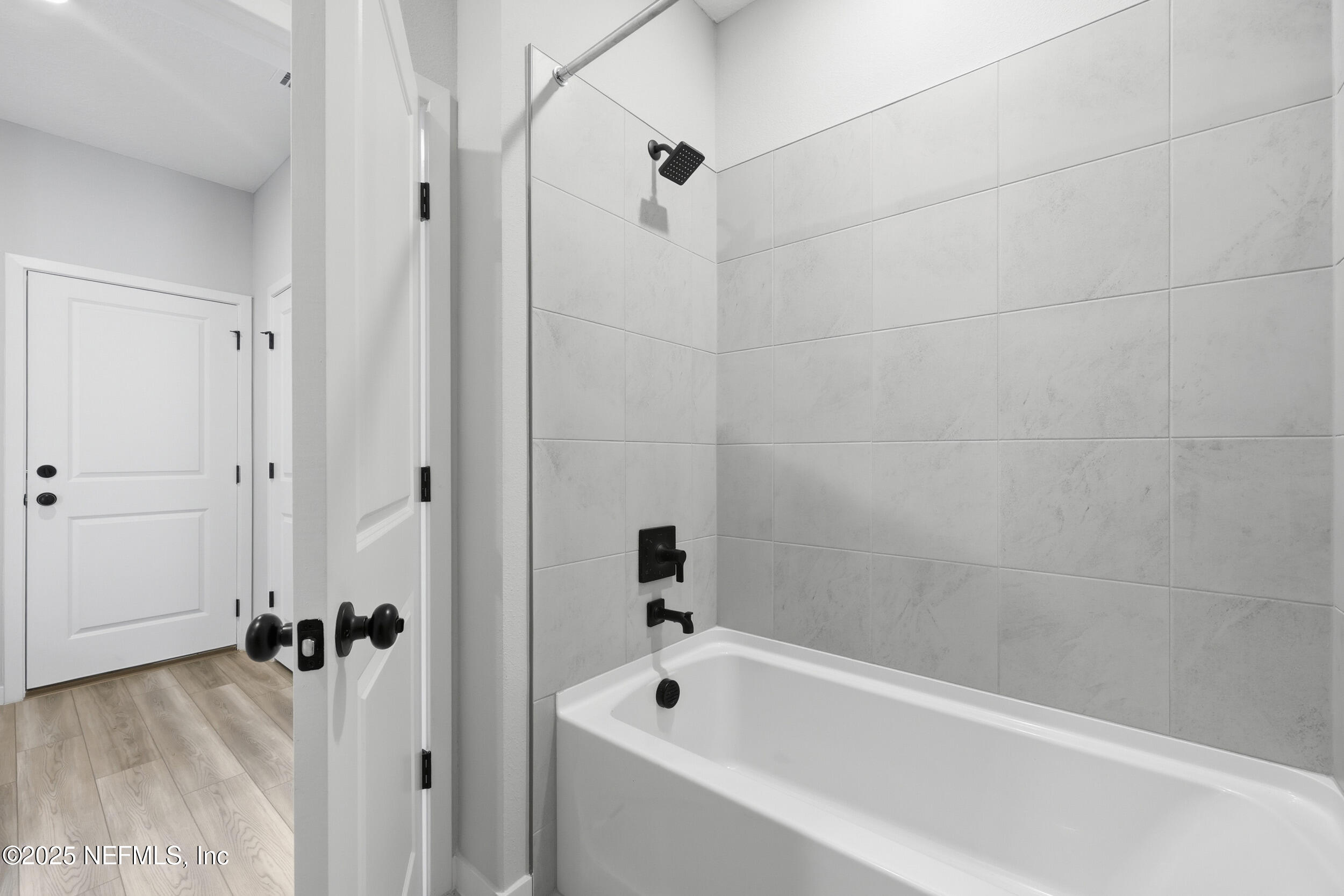 96509 Stillpoint Way Fernandina Beach, FL 32034 - Photo 17 of 32 a bathroom with a tub