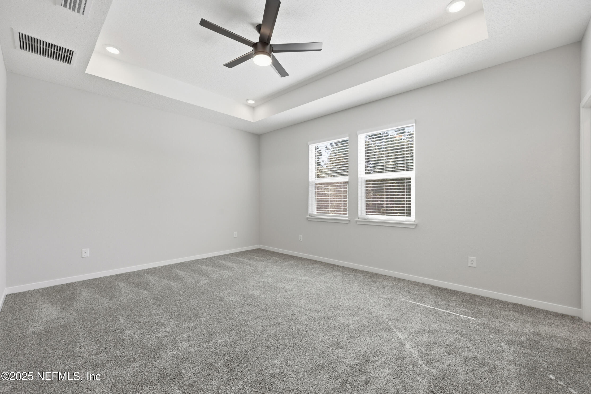 96509 Stillpoint Way Fernandina Beach, FL 32034 - Photo 22 of 32 an empty room with a window and ceiling fan