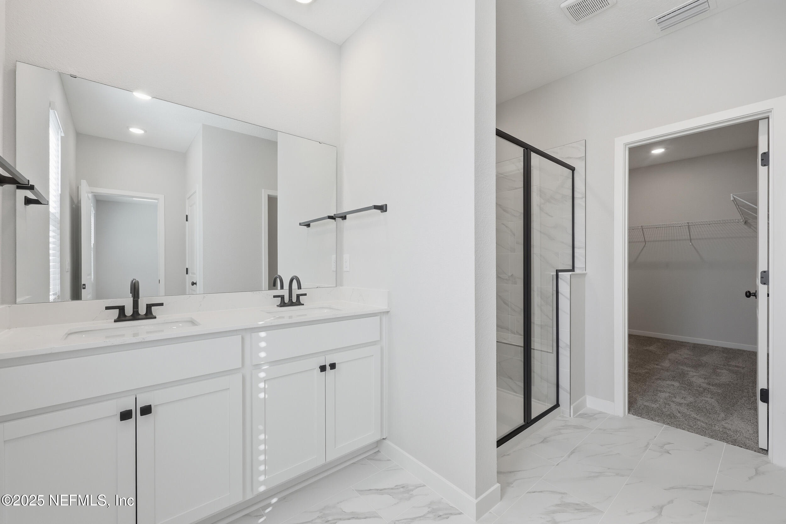 96509 Stillpoint Way Fernandina Beach, FL 32034 - Photo 23 of 32 a bathroom with a sink and a mirror