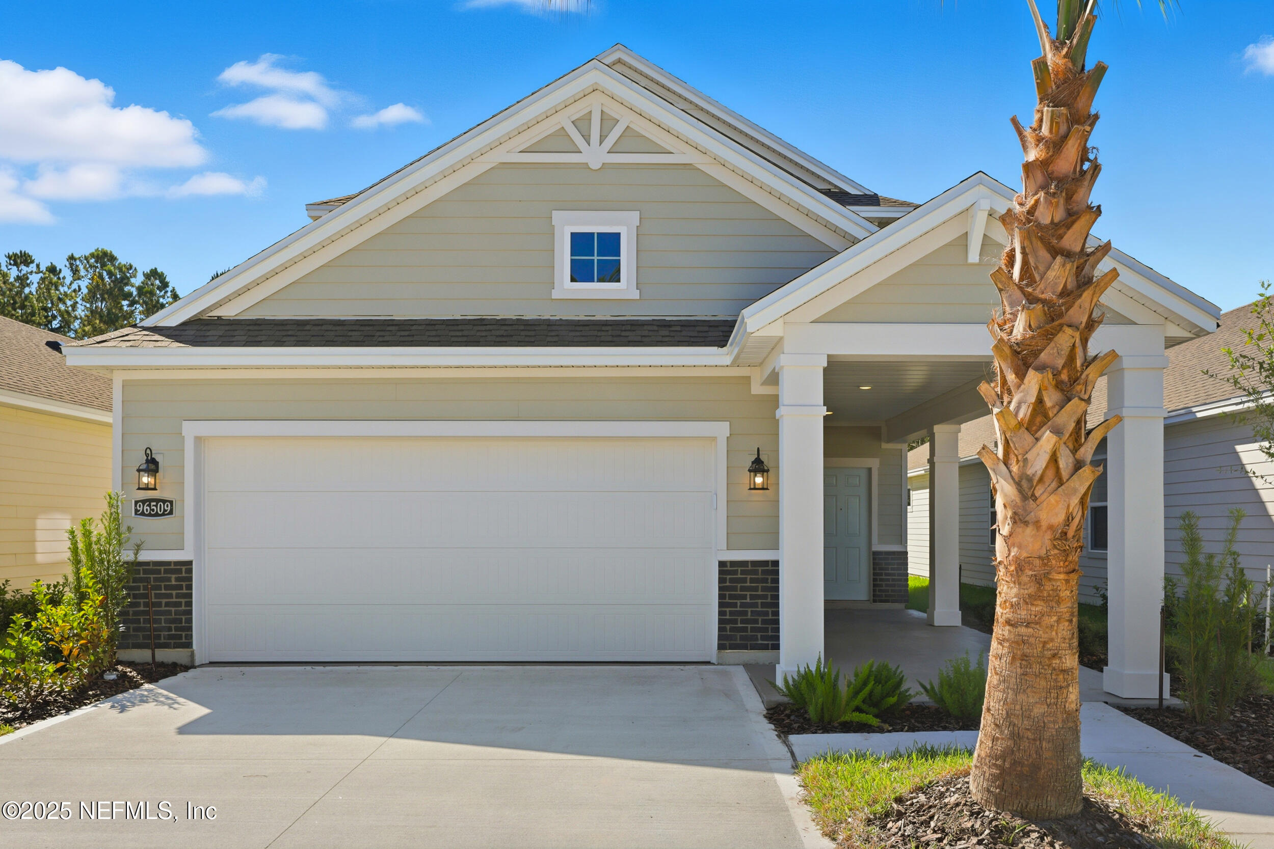 96509 Stillpoint Way Fernandina Beach, FL 32034 - Photo 31 of 32 a front view of a house with a yard