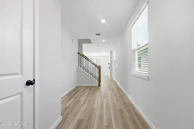 a view of hallway with stairs