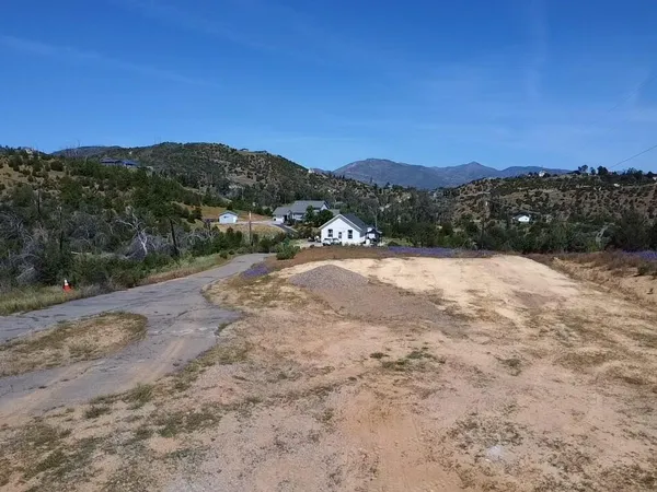 a view of a backyard of a house