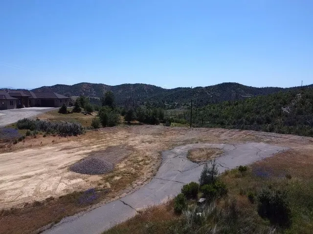 a view of a town with mountains in the background
