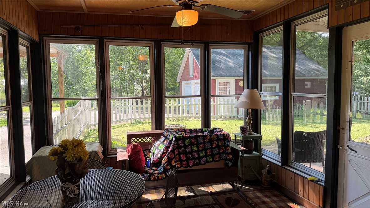 154 Taylor Road Barberton, OH 44203 - Photo 12 of 36 Sunroom with lots of windows and ceiling fan.