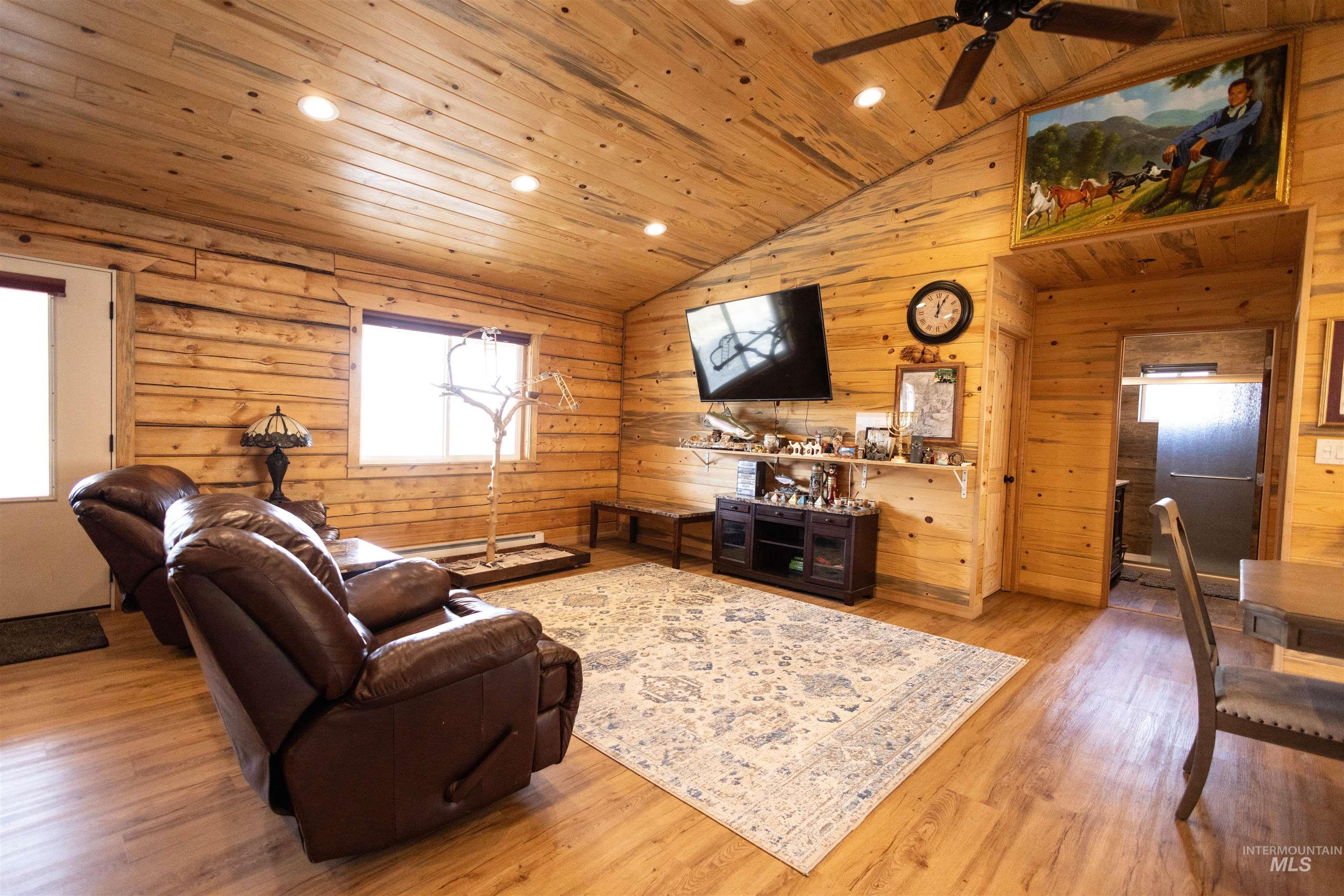 830 Leitch Creek Road Kooskia, ID 83539 - Photo 18 of 49 Living area with light wood finished floors, recessed lighting, wood ceiling, wooden walls, and high vaulted ceiling