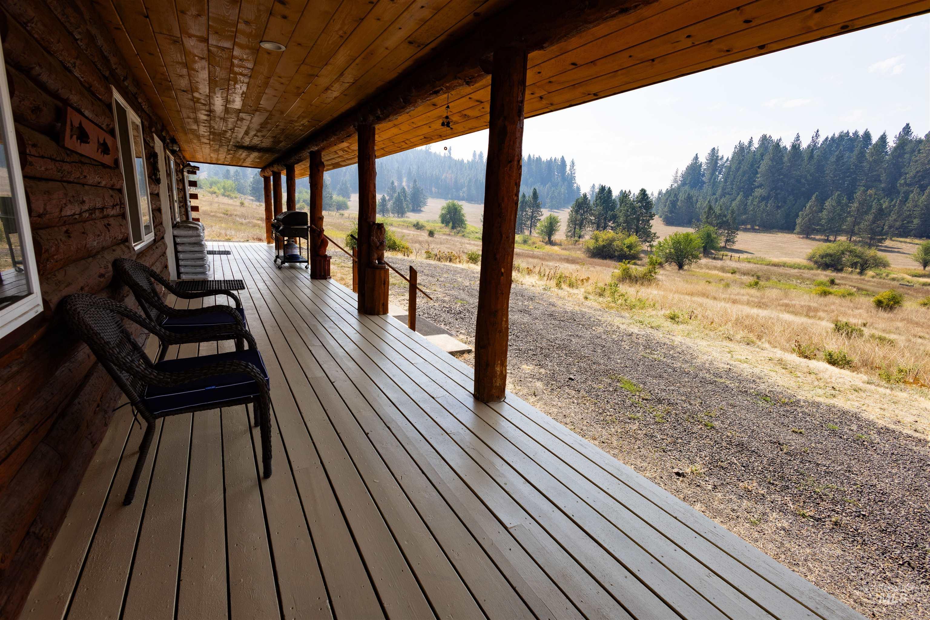 830 Leitch Creek Road Kooskia, ID 83539 - Photo 33 of 49 Wooden porch with a view of countryside and area for grilling