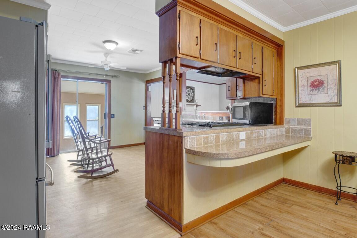 538 Kennerson Road Opelousas, LA 70570 - Photo 5 of 25 Kitchen with snack bar/laundry/ pantry