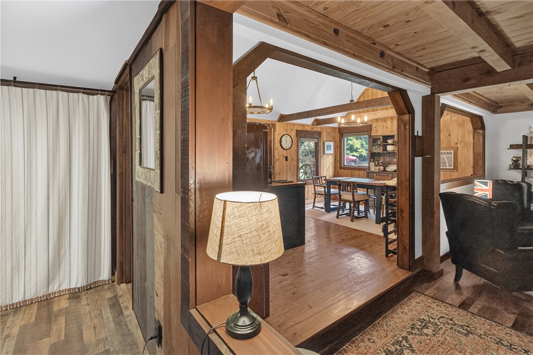 130 Maggie Rufus Lane Westminster, SC 29693 - Photo 13 of 50 Rich wood walls and ceiling beams provide warmth and rustic charm to this inviting interior space.