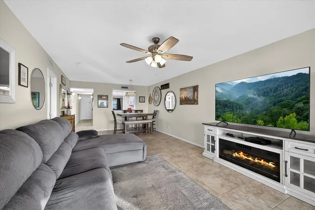 a bathroom with a granite countertop sink a mirror and shower
