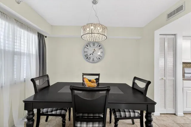 a kitchen with stainless steel appliances granite countertop a sink a stove cabinets and counter space