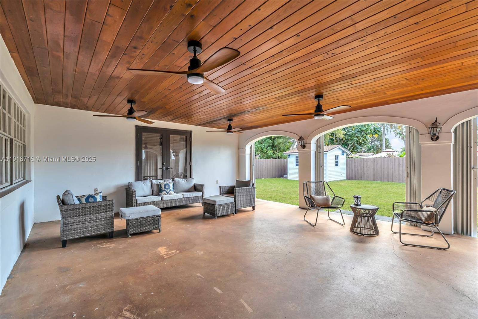 6376 Southwest 15th Street, Unit 6376 West Miami, FL 33155 - Photo 19 of 23 a view of a patio with couches and pool