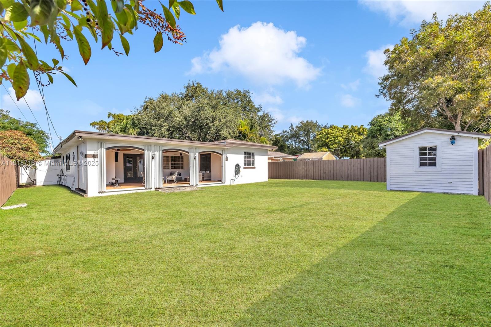 6376 Southwest 15th Street, Unit 6376 West Miami, FL 33155 - Photo 22 of 23 a view of a house with a backyard