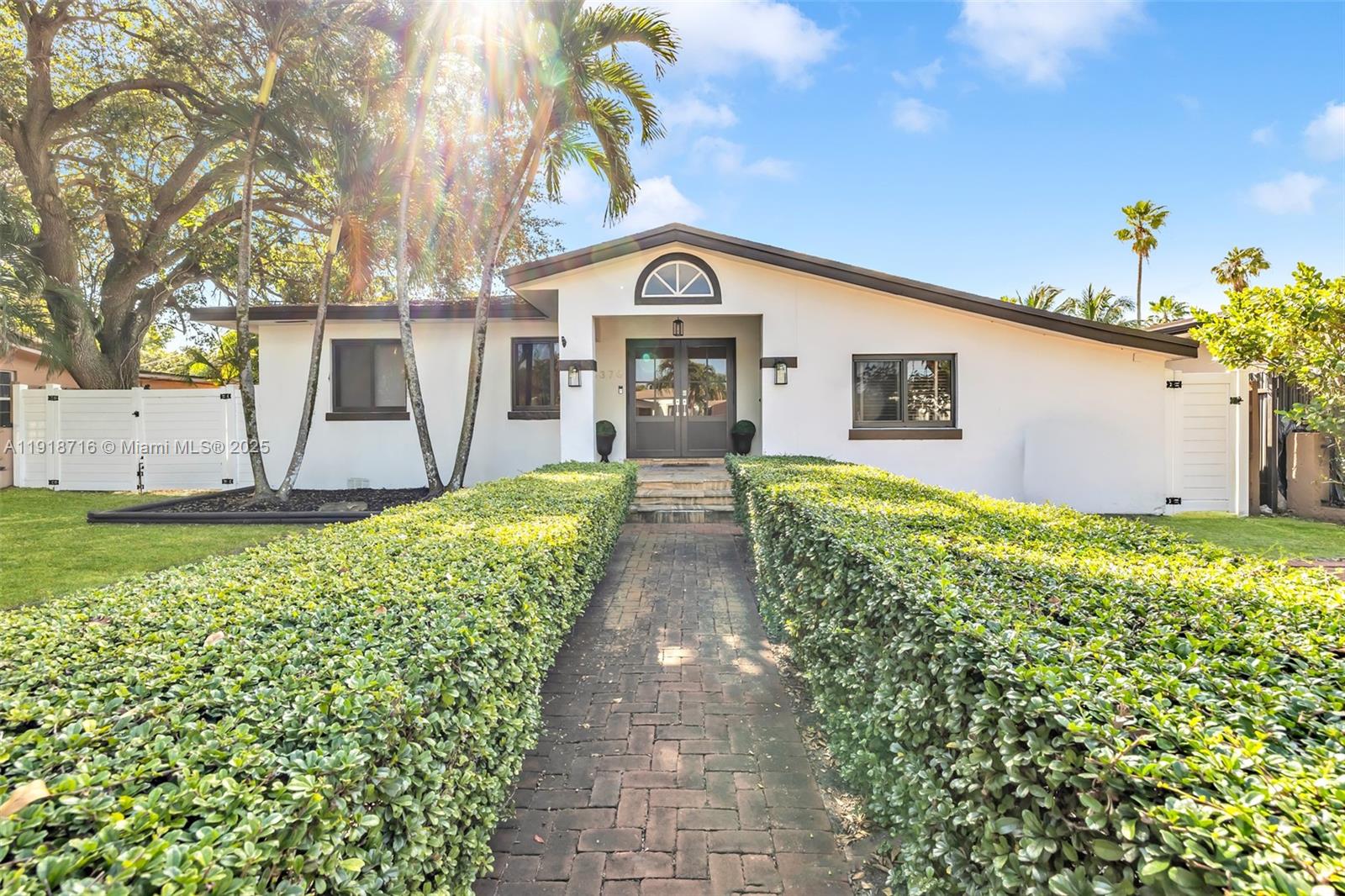 6376 Southwest 15th Street, Unit 6376 West Miami, FL 33155 - Photo 3 of 23 a view of a house with a yard and potted plants