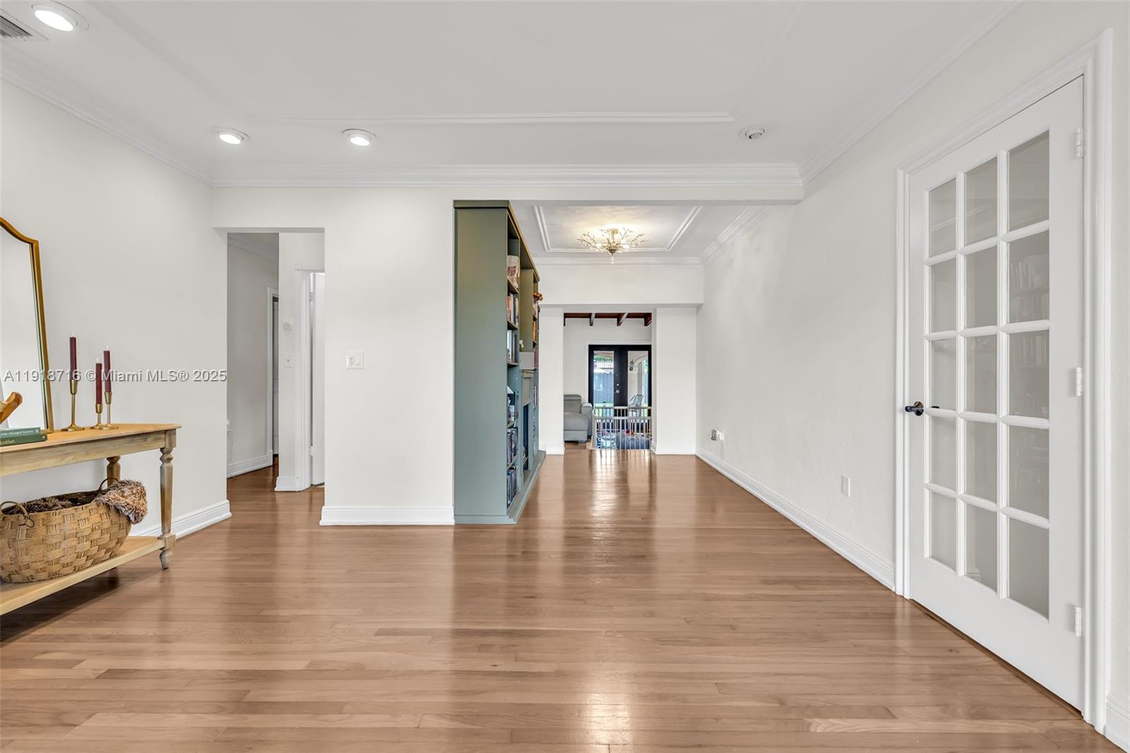 6376 Southwest 15th Street, Unit 6376 West Miami, FL 33155 - Photo 4 of 23 a view of empty room with wooden floor and fireplace