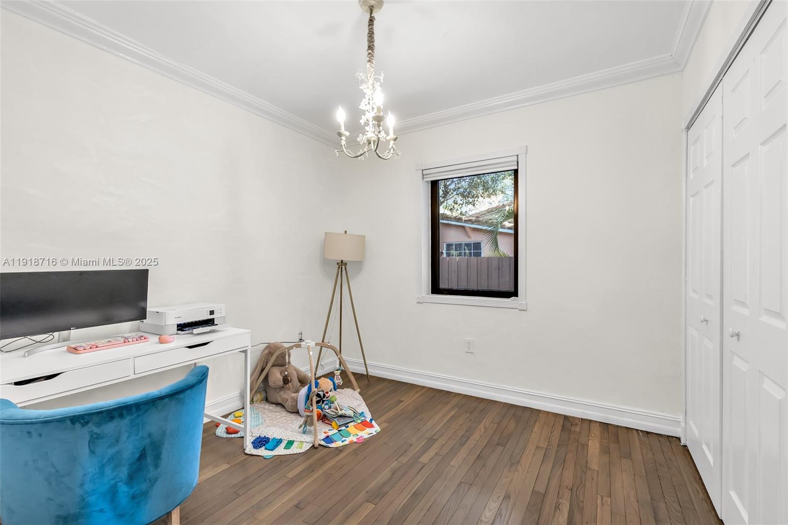 6376 Southwest 15th Street, Unit 6376 West Miami, FL 33155 - Photo 10 of 23 a view of a workspace with furniture and chandelier