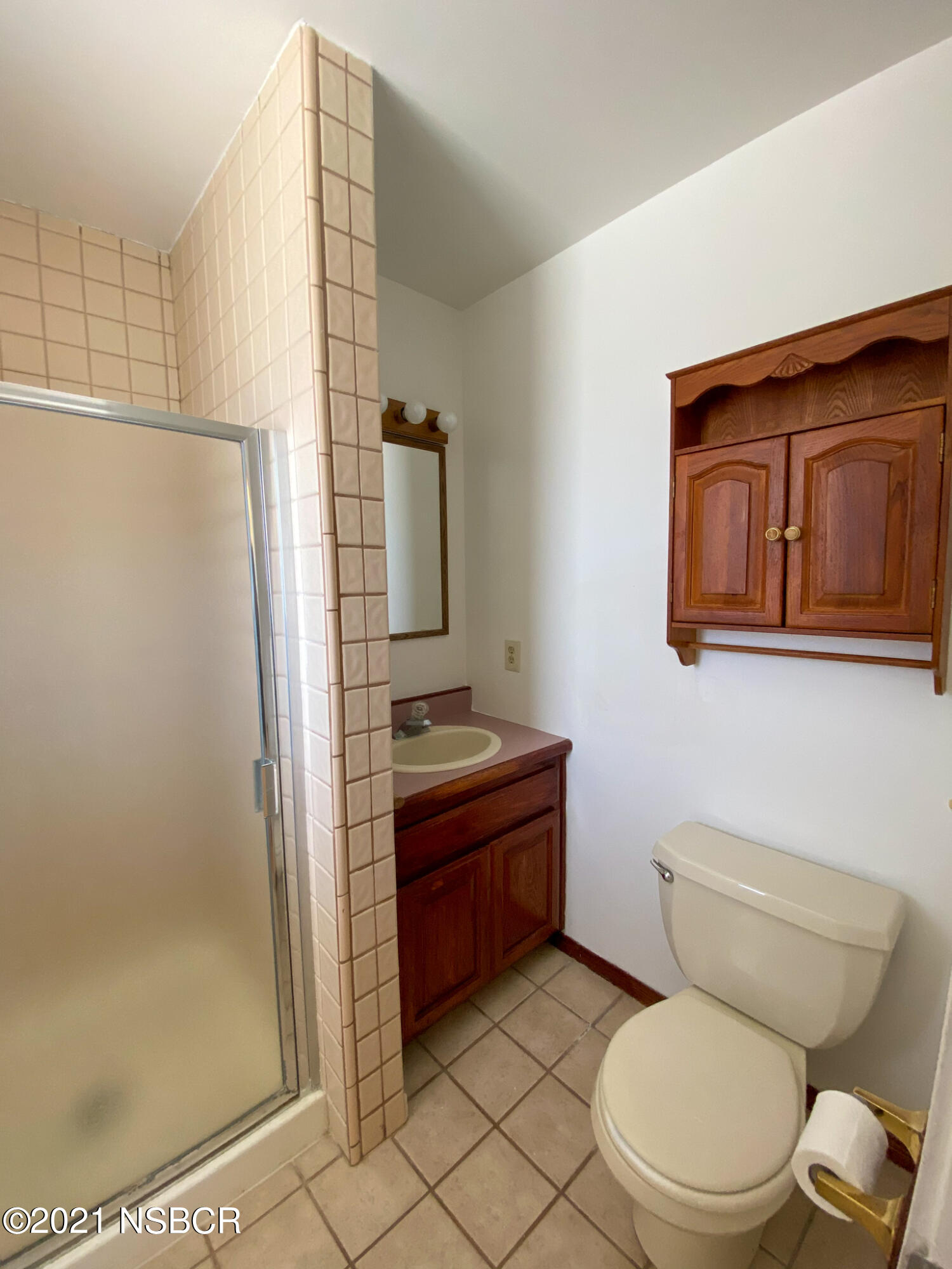 3941 Spica Way Lompoc, CA 93436 - Photo 16 of 24 a bathroom with a toilet a sink and shower