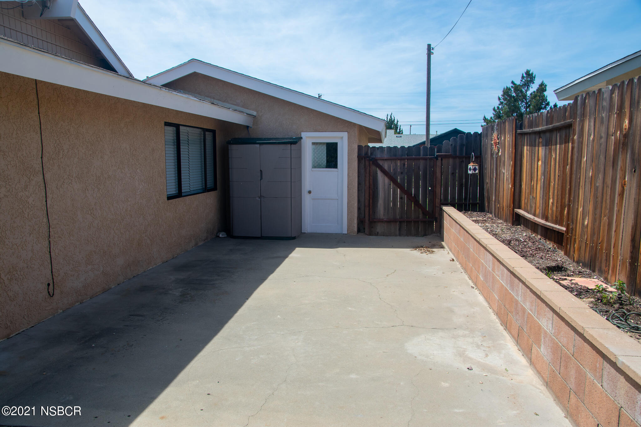 3941 Spica Way Lompoc, CA 93436 - Photo 23 of 24 a view of backyard with wooden fence