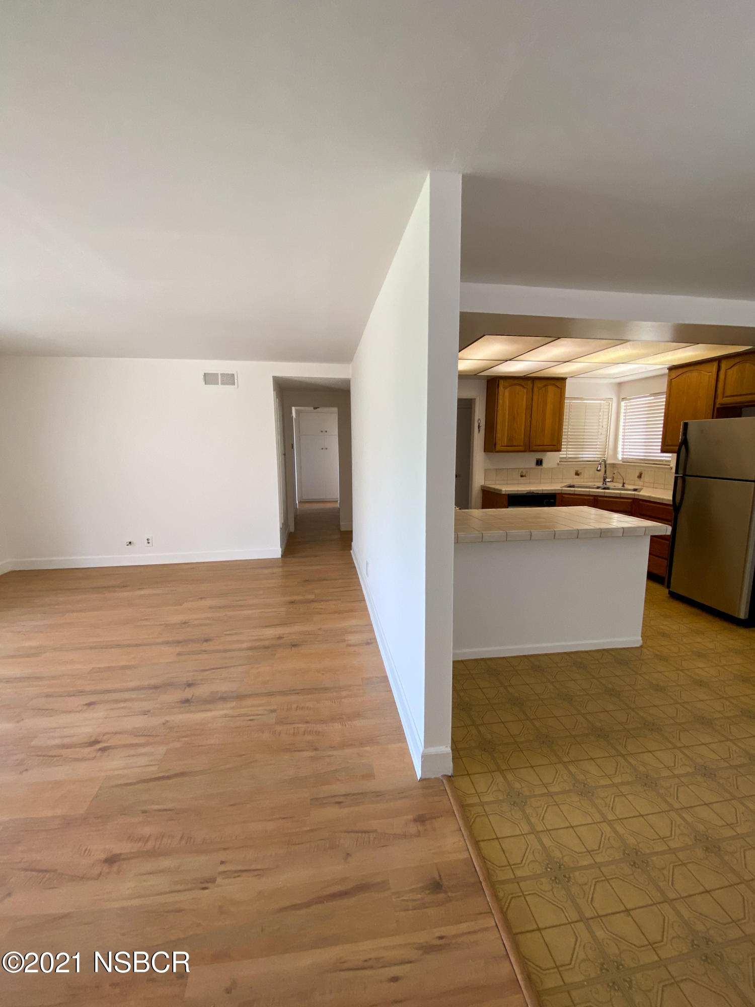 3941 Spica Way Lompoc, CA 93436 - Photo 4 of 24 a view of a living room with a sink and dishwasher