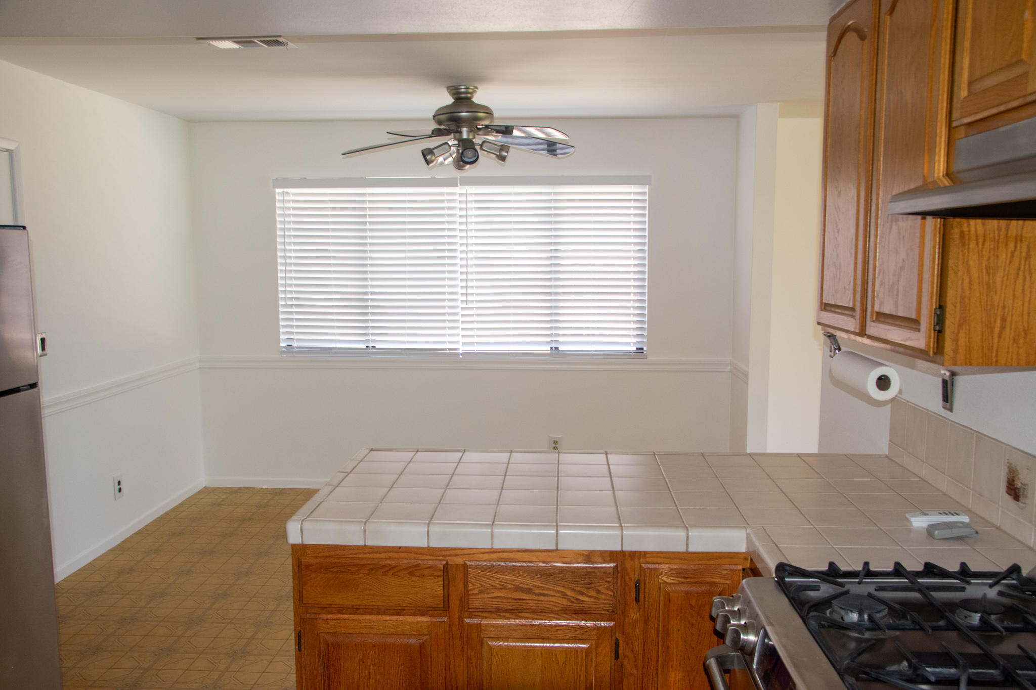 3941 Spica Way Lompoc, CA 93436 - Photo 6 of 24 a kitchen that has a stove and a table in it